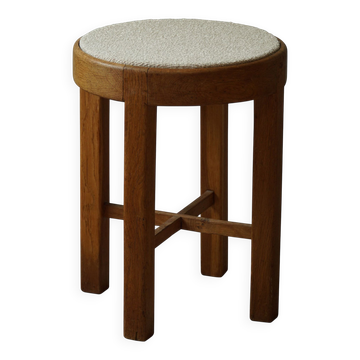 Danish mid-century stool in oak and reupholstered in Boucle wool, from the 1950s.