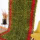 Handmade pure wool rug in green and red, size 140/260 cm.