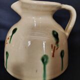 Vintage glazed terracotta ceramic jug from the 20th century.