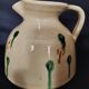 Vintage glazed terracotta ceramic jug from the 20th century.