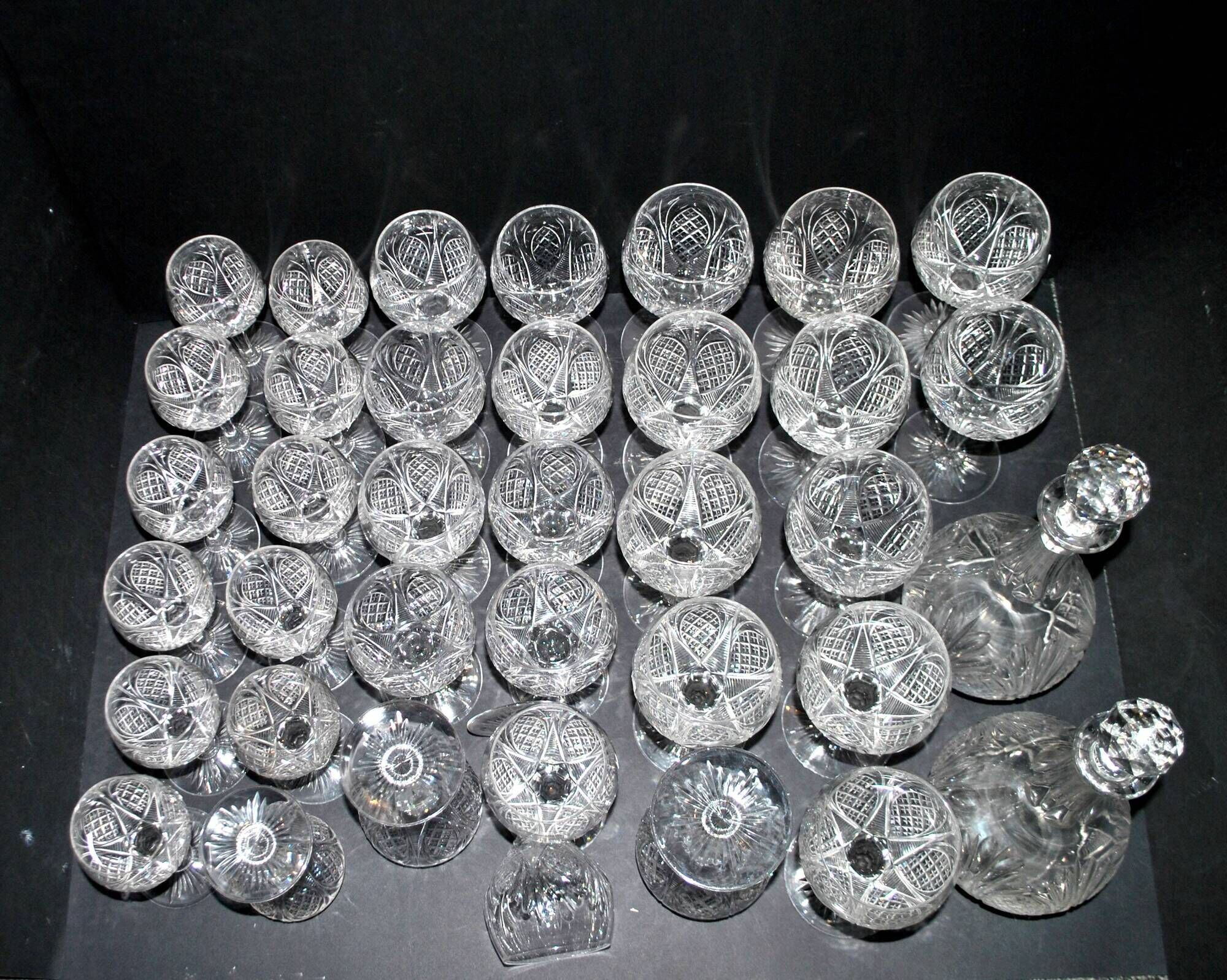 Baccarat set of 35 crystal glasses + 2 flower model carafes 9157 from 1907