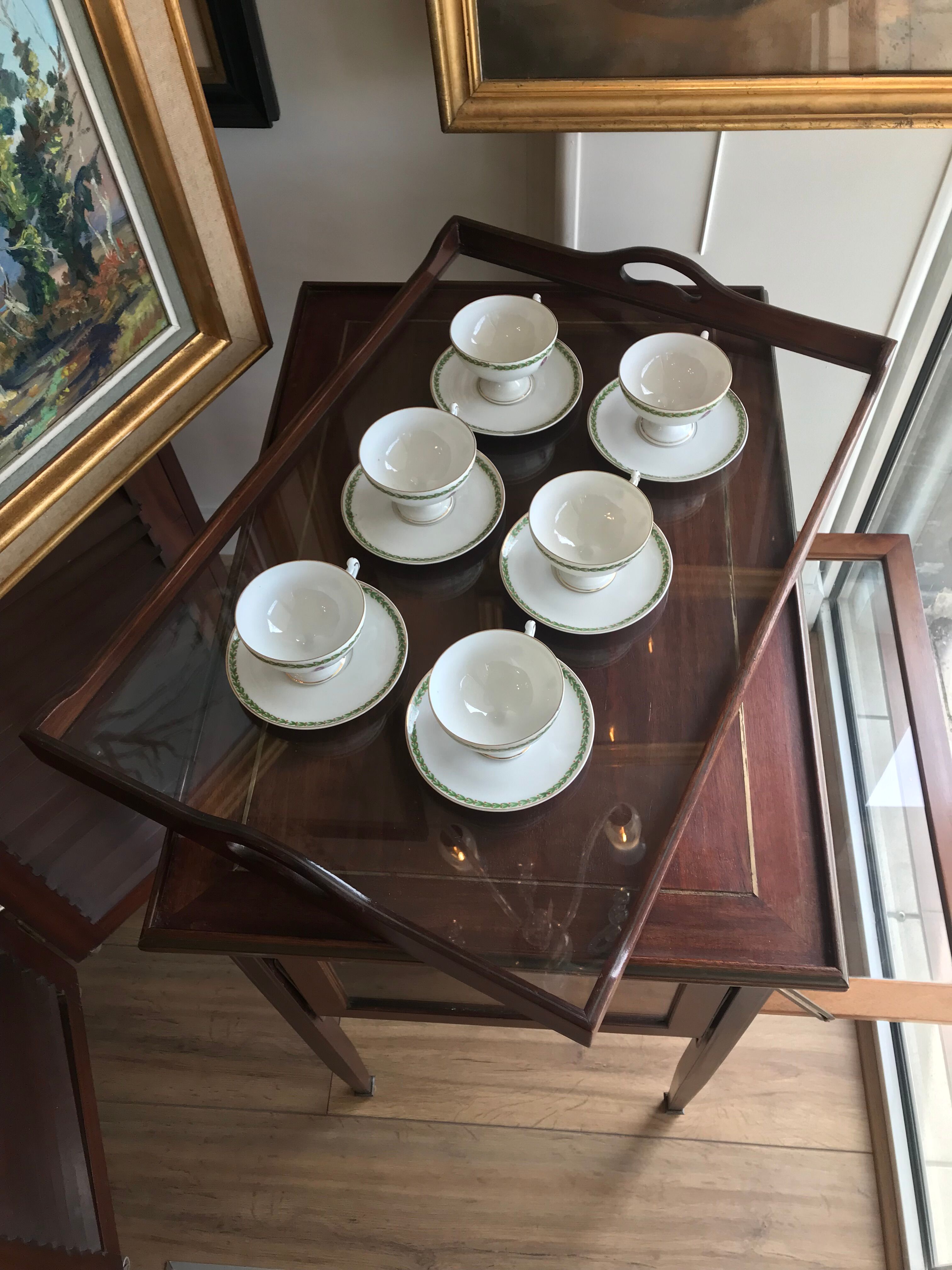 Glass-enclosed old tea table with wooden tray, bronze and brass