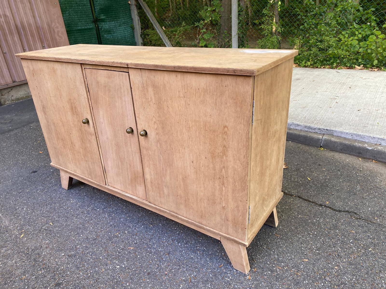 Vintage 1950s oak enfilade buffet with tapered legs.