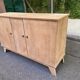 Vintage 1950s oak enfilade buffet with tapered legs.