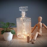 Old whisky carafe in relief glass