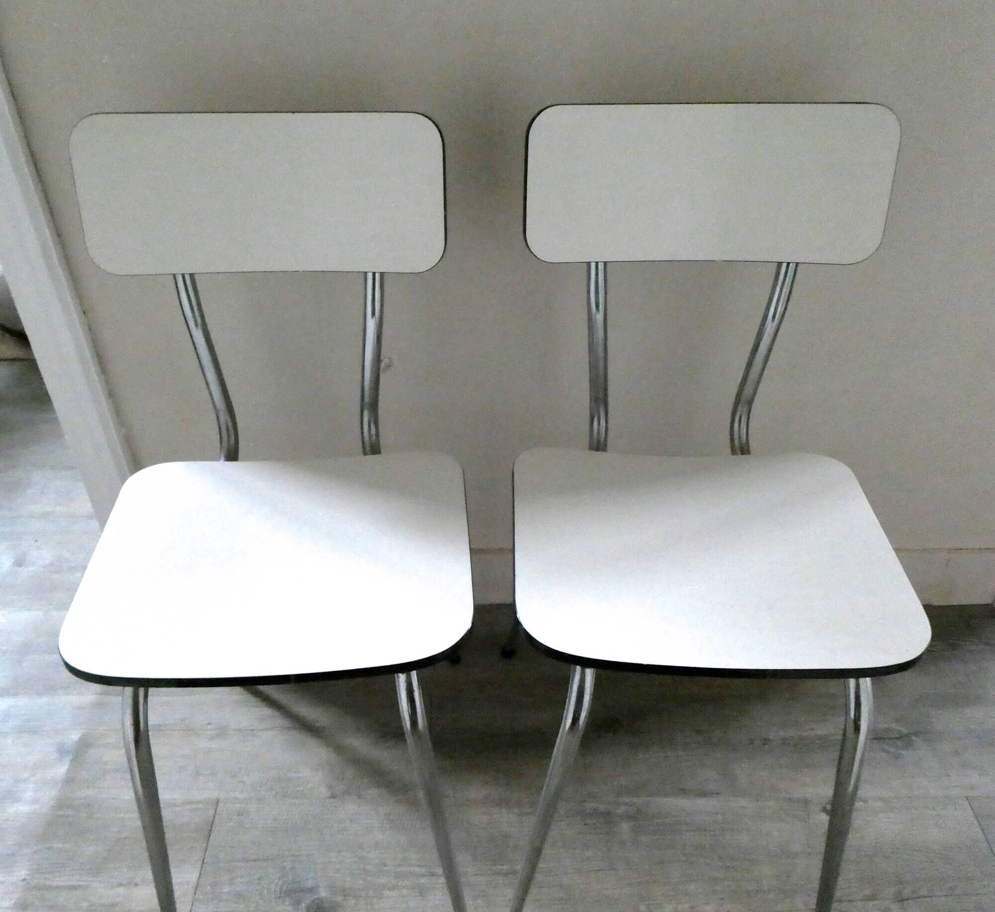Pair of white formica and slender feet of the 60s Chair