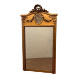Miroir de style Louis XVI en bois et stuc doré XX siècle