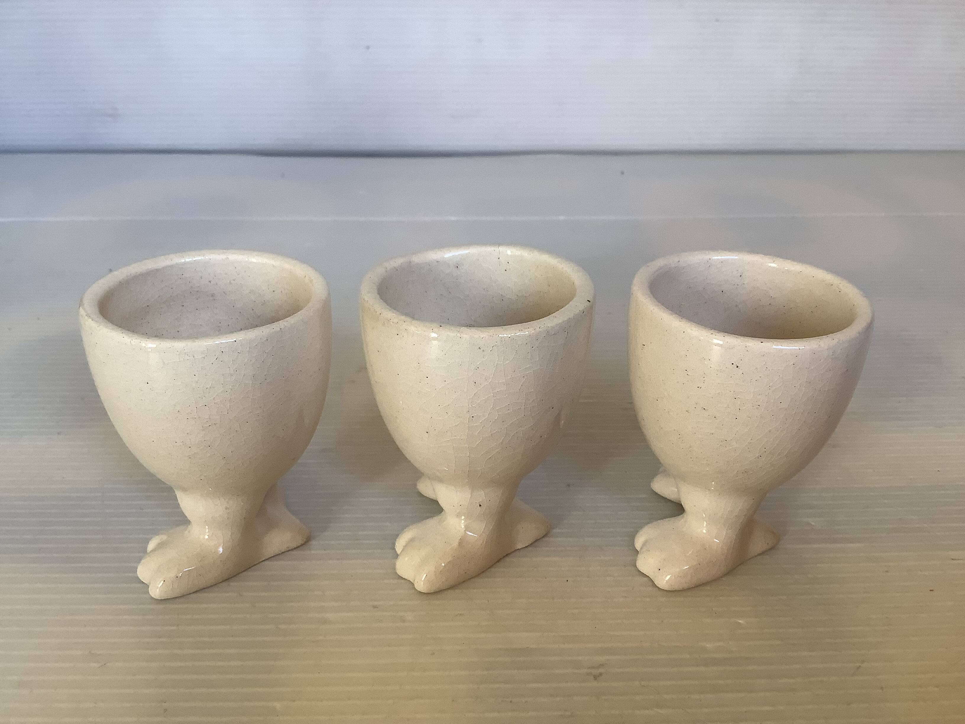 Set of cracked egg cups with feet