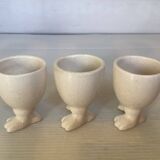Set of cracked egg cups with feet