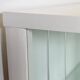 White vintage slatted display case on gold legs