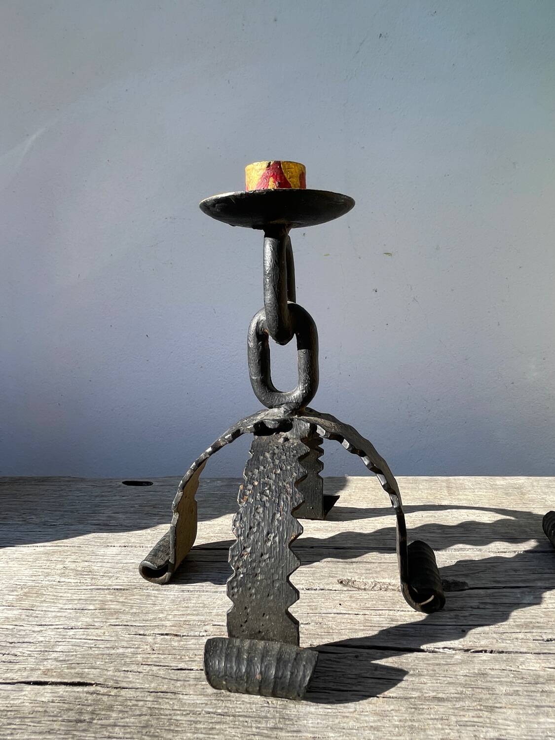 Pair of candlesticks with wrought iron chain