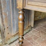 Old French farmhouse table in walnut with turned legs.