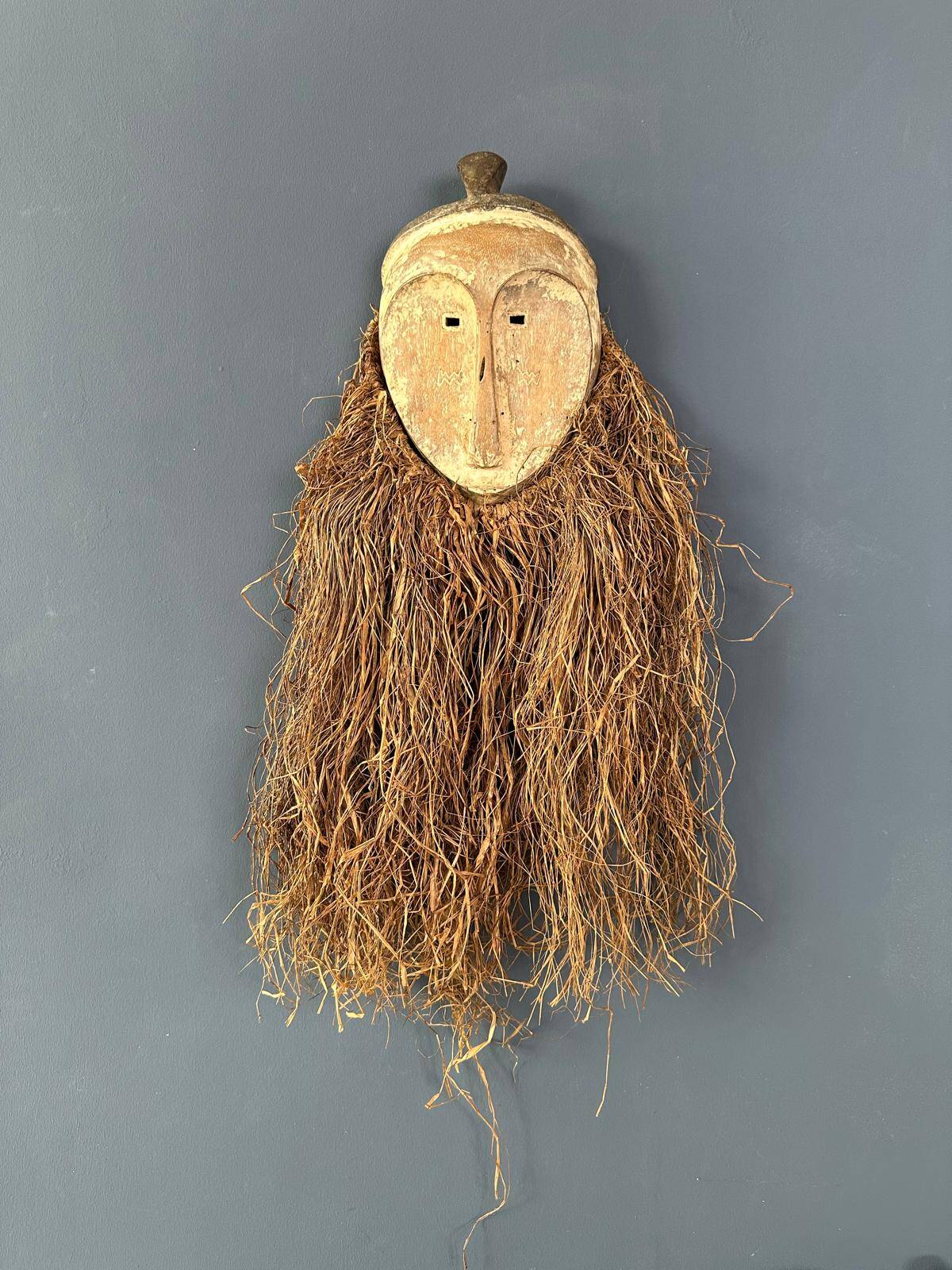 Long face tribal mask with narrow eye-holes