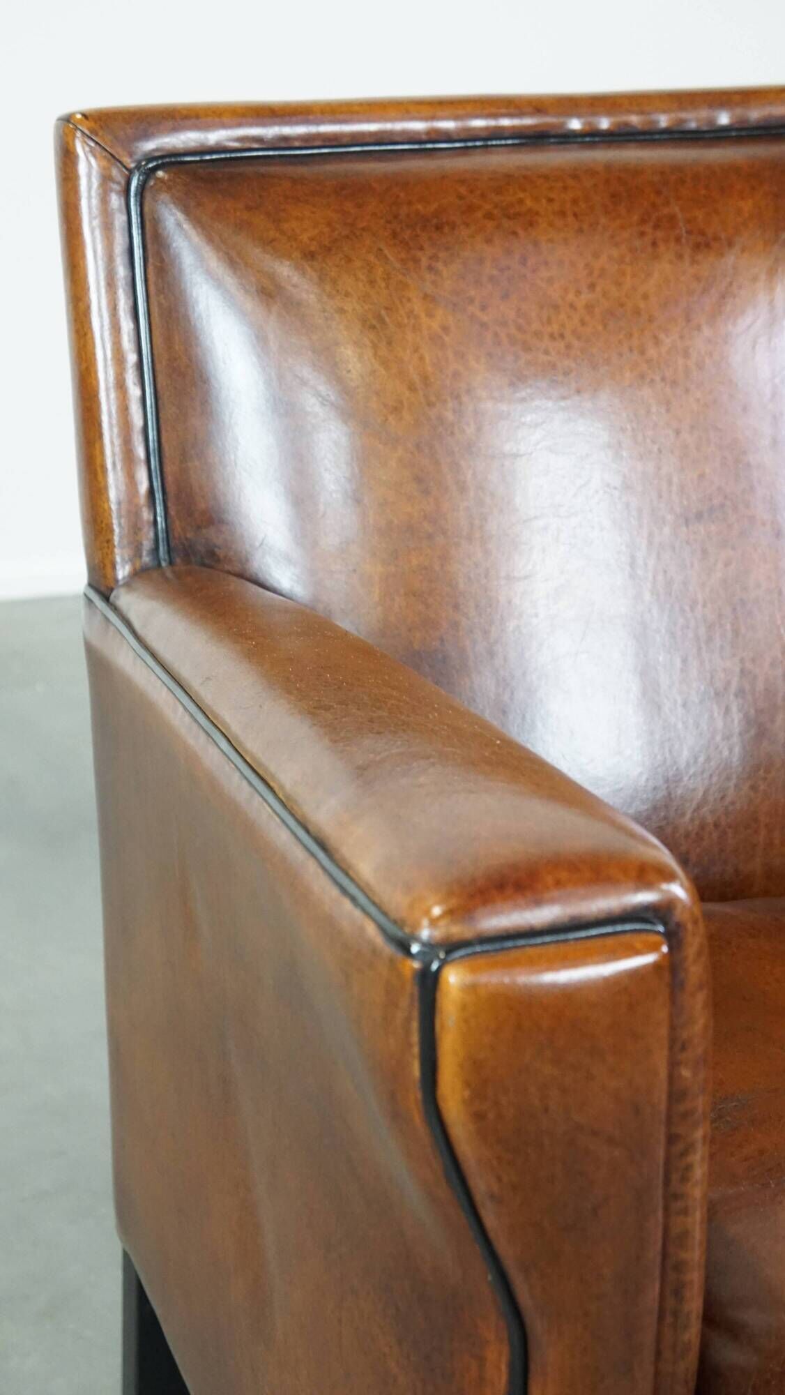 Cognac-colored sheep leather Art Deco design armchair finished with piping