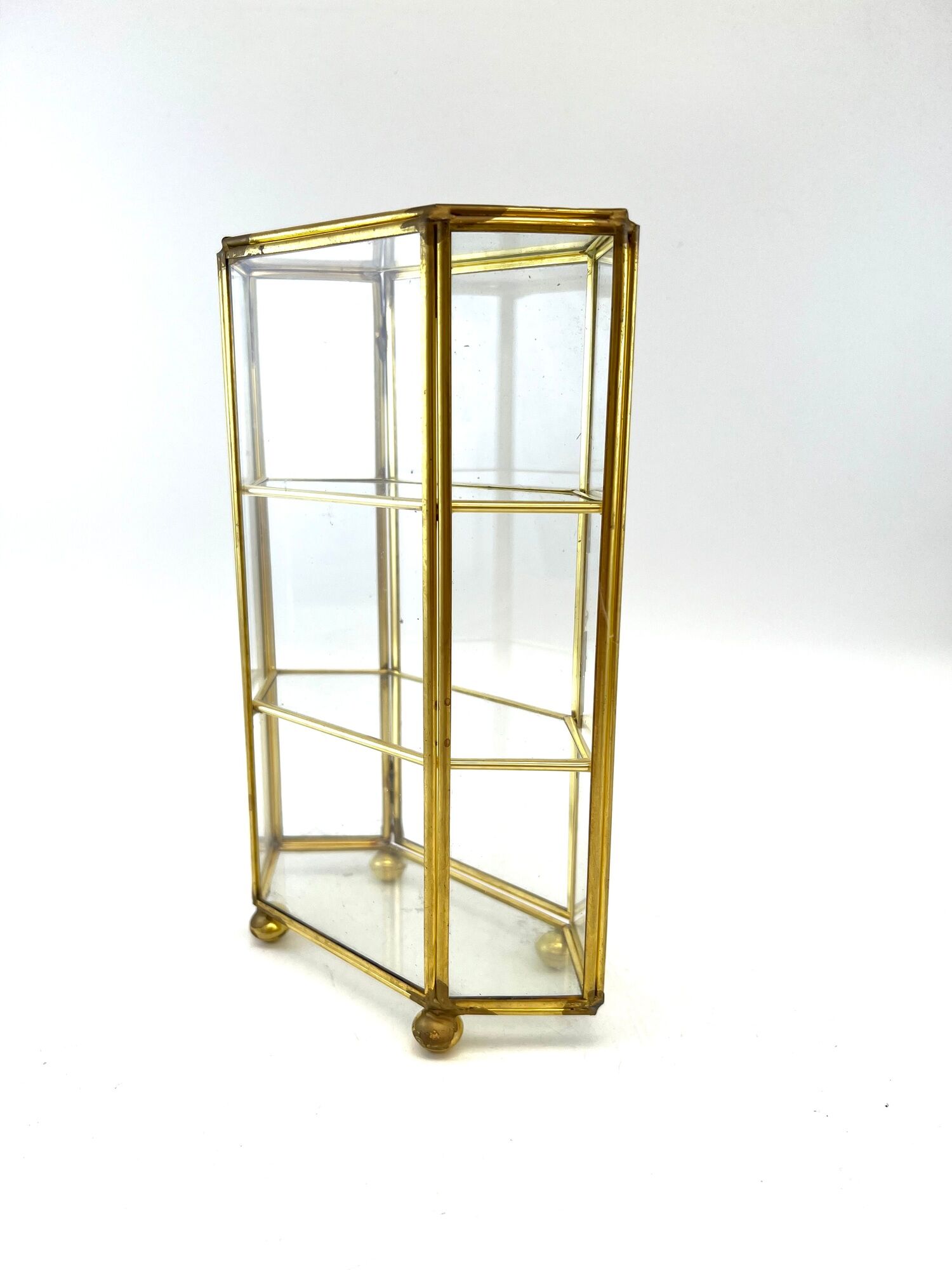 Glass and brass jewelry showcase