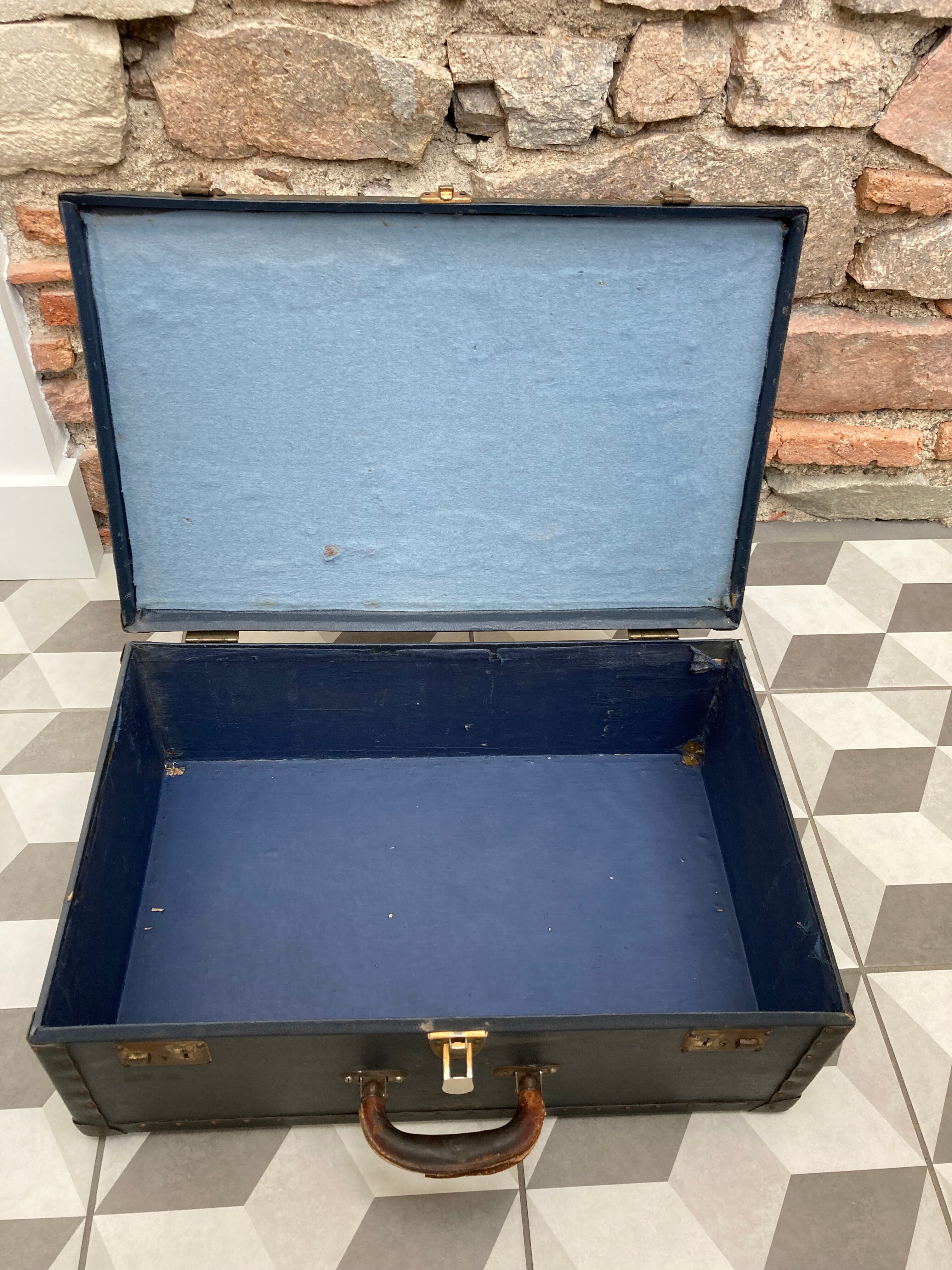 Midnight blue suitcase of representative 30s
