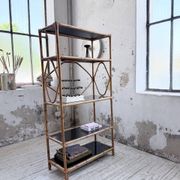 Rattan bookshelf and black glasses