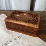 Carved wooden box with brass inlay