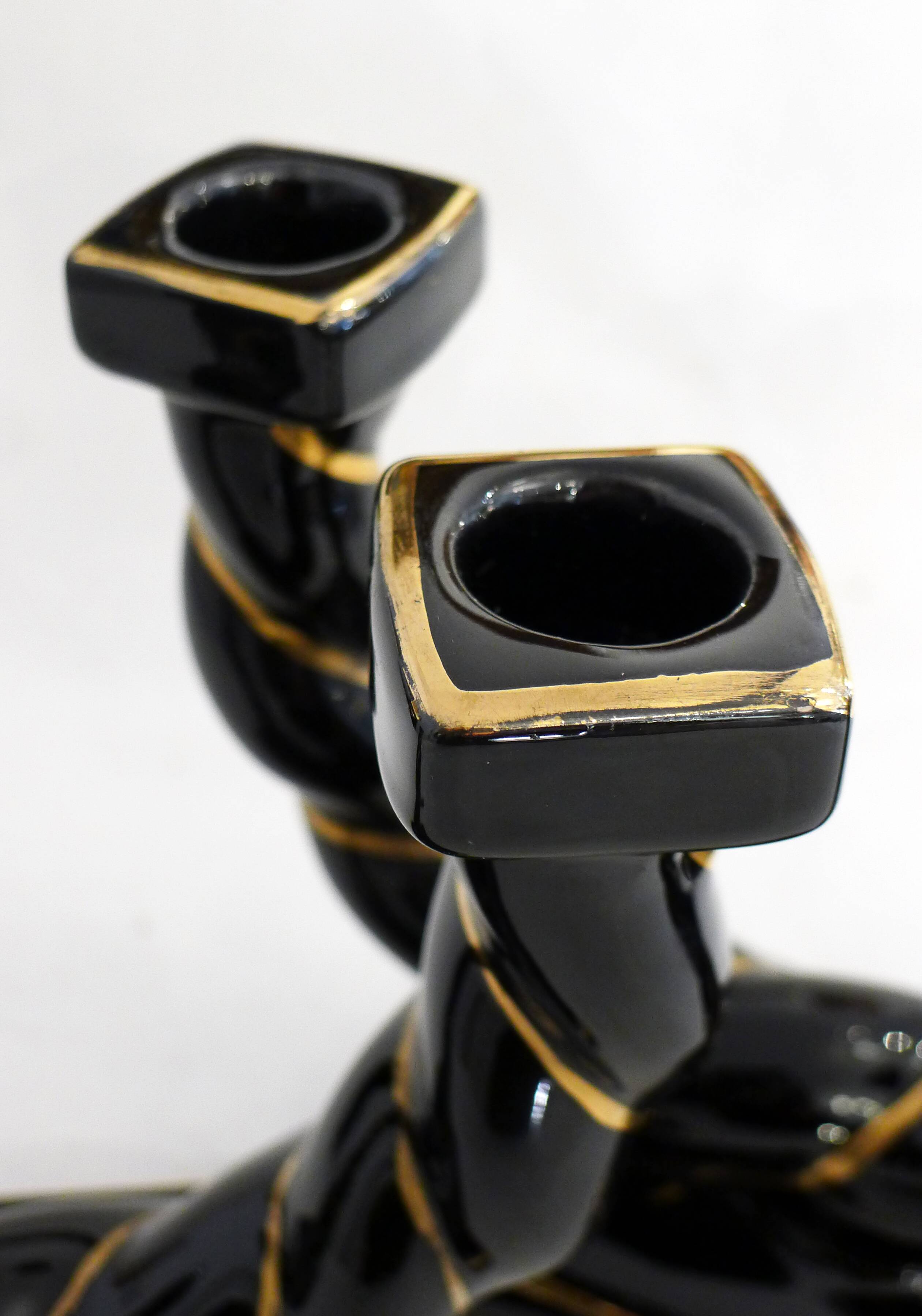 Pair of earthenware braided rope candlesticks