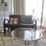 Round coffee table in smoked glass with chrome legs