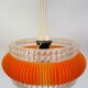 Transparent plastic space age lustre with orange band from the 70s.