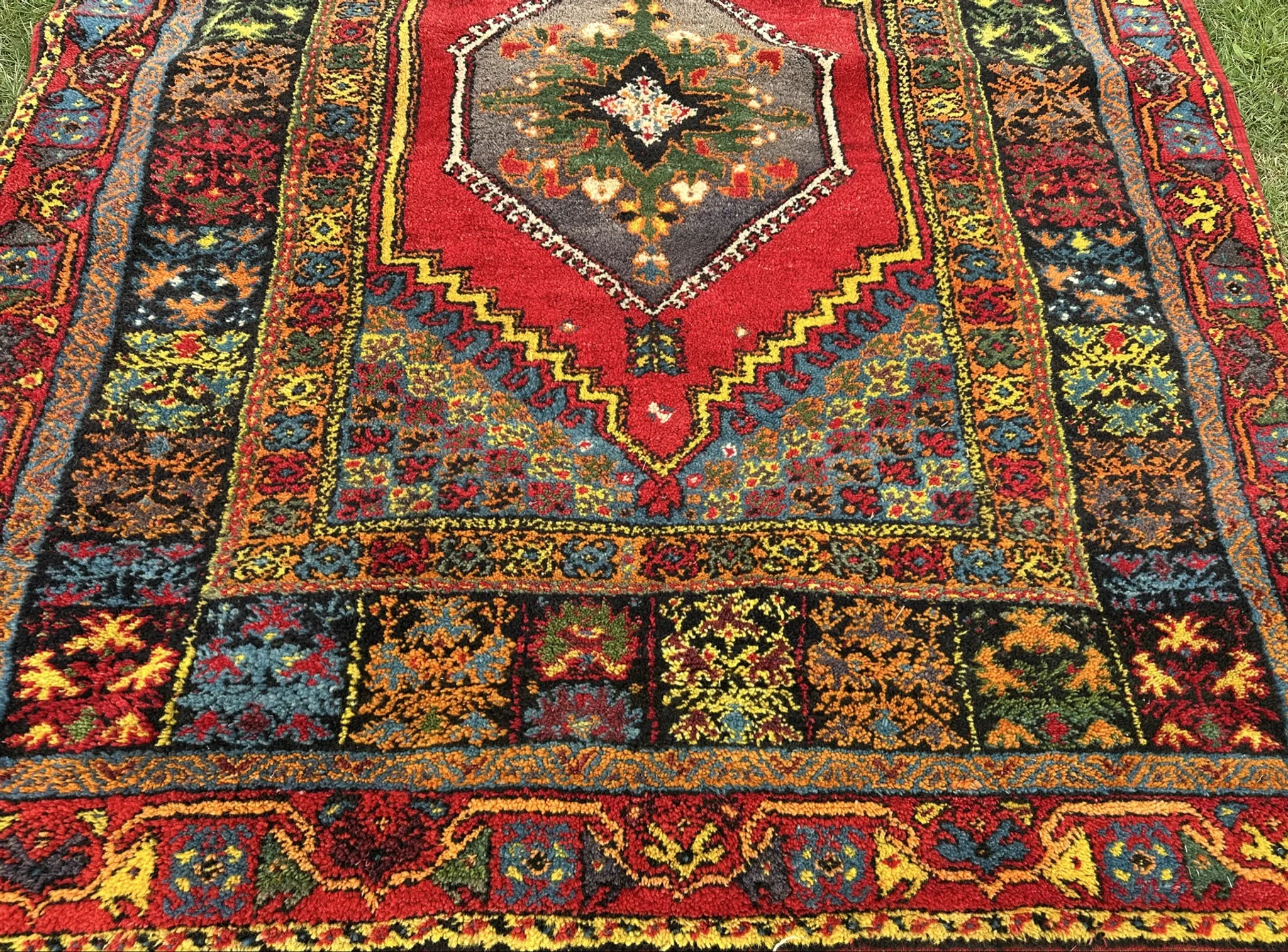 Old Moroccan carpet, made of natural wool and handwoven.