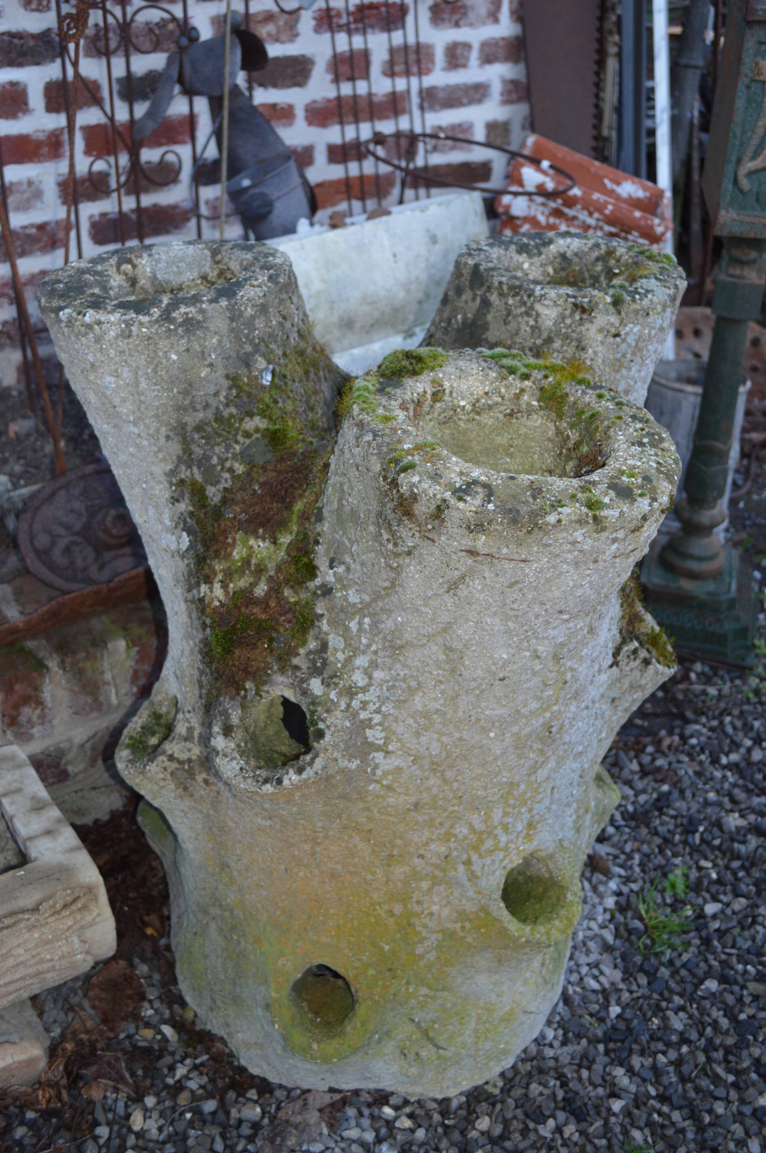 Concrete tree trunk planter