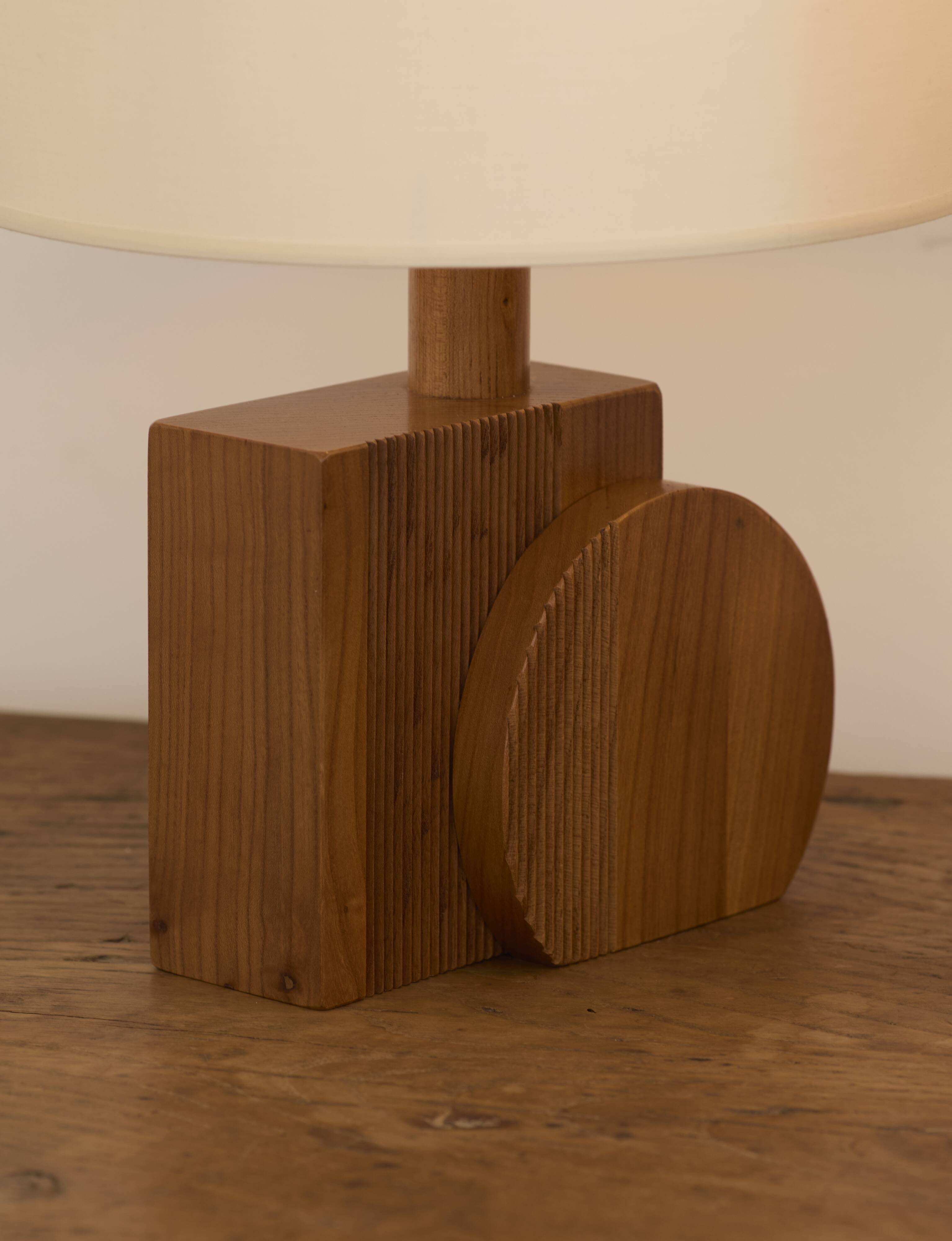 Pair of geometric handcrafted lamps in solid oak circa 1970.
