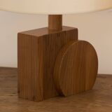 Pair of geometric handcrafted lamps in solid oak circa 1970.