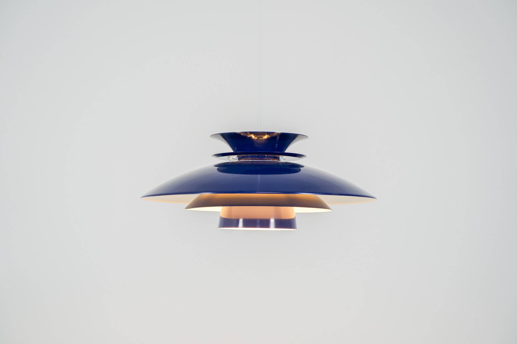 Elegant blue pendant light by Belux