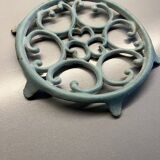 Old cast iron trivety turquoise