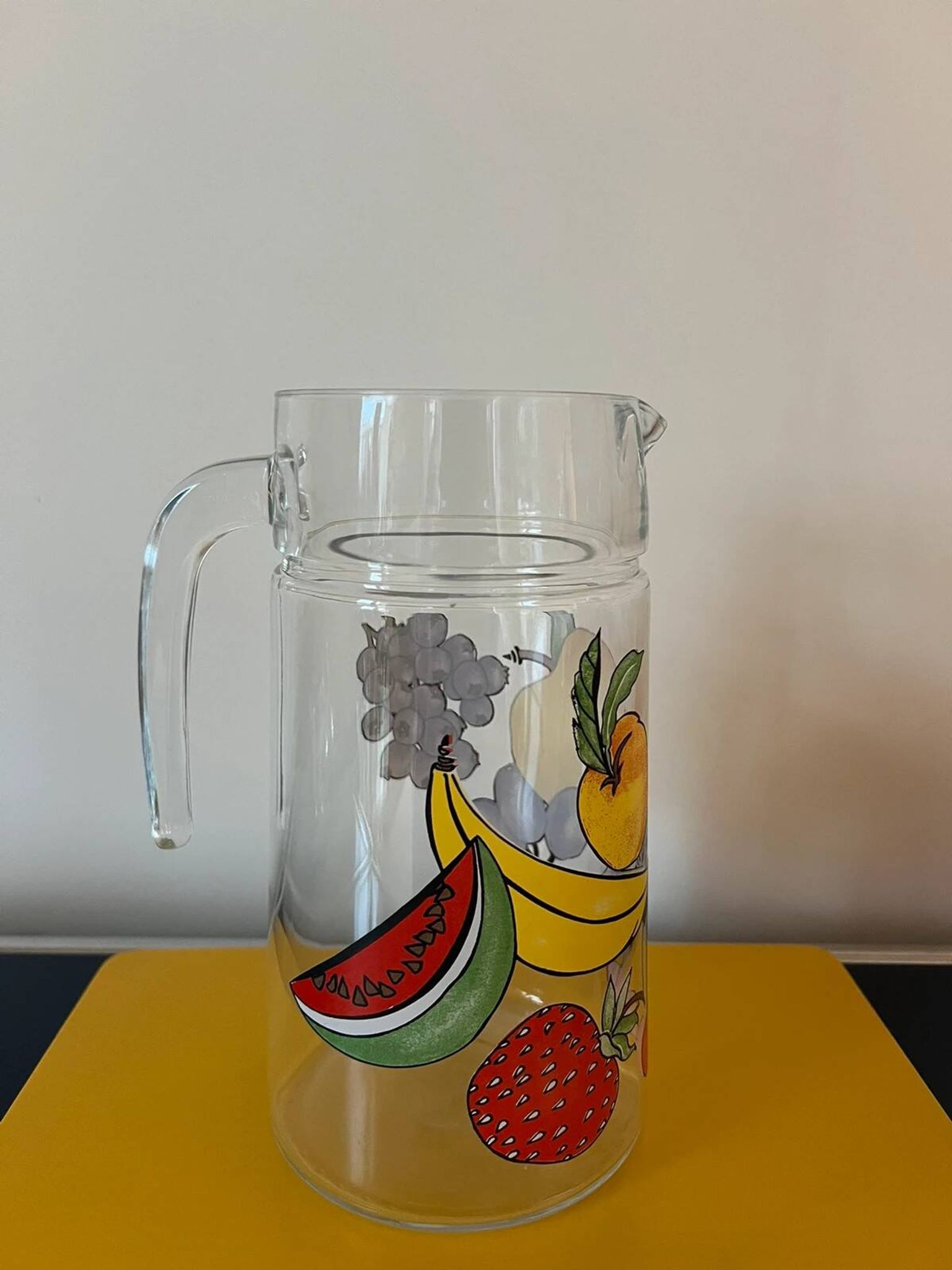 Vintage glass carafe with painted fruits
