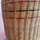 High basket with woven straws