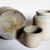 Set of three pots with old condiments in glazed earth