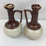 Antique handmade pitchers in beige and brown enamelled terracotta