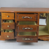 Wooden jewelry box in the shape of a chest of drawers