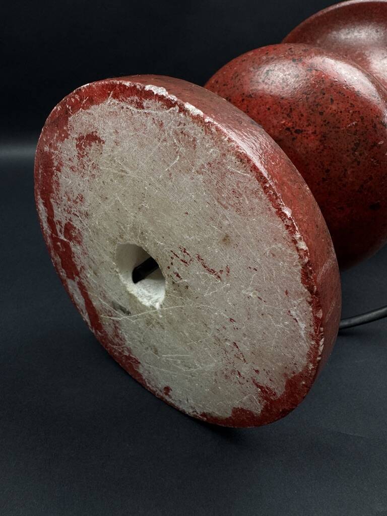 Lamp base in reconstituted stone, red "oxblood", 20th century
