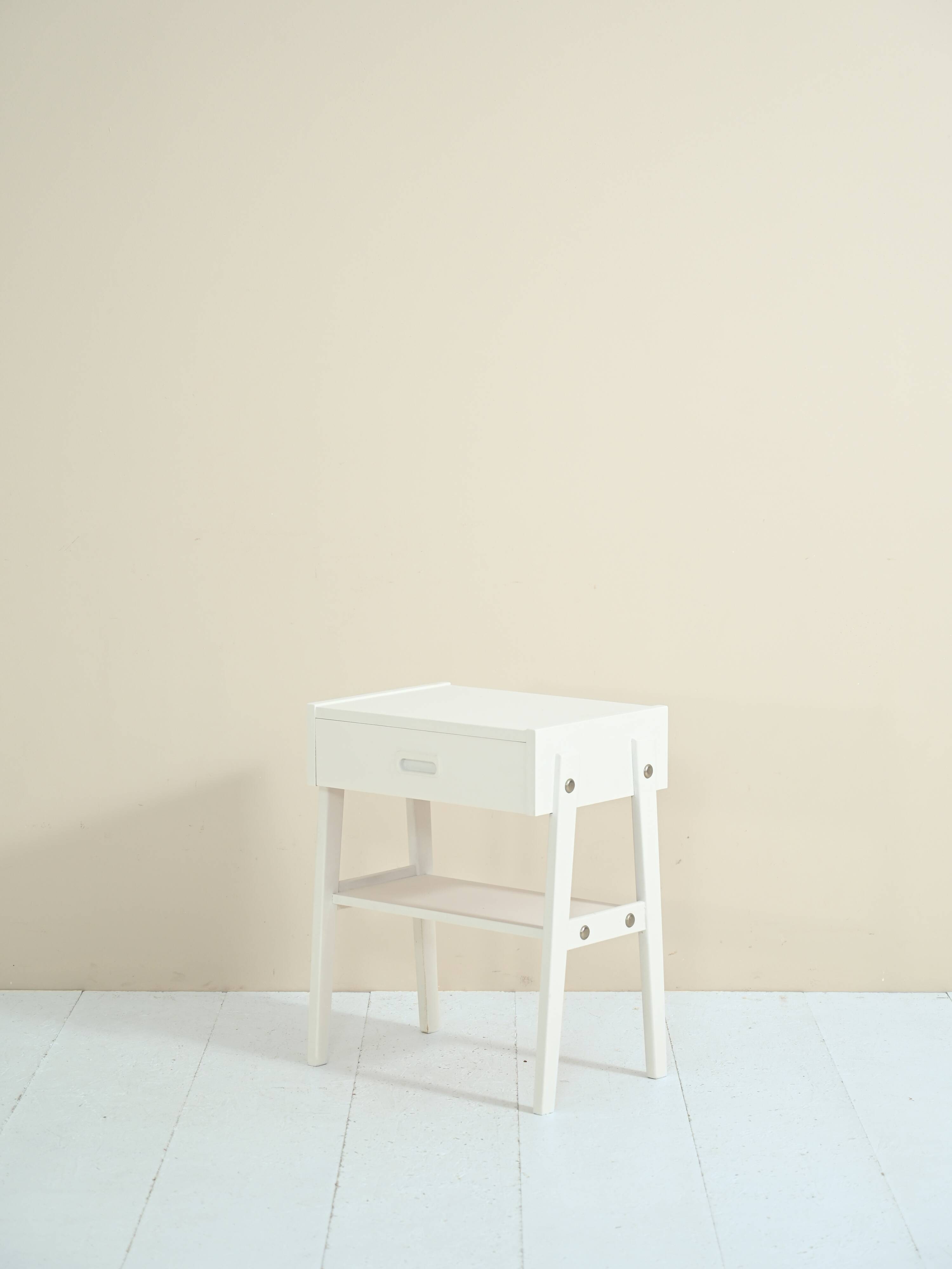 Scandinavian bedside table painted in white