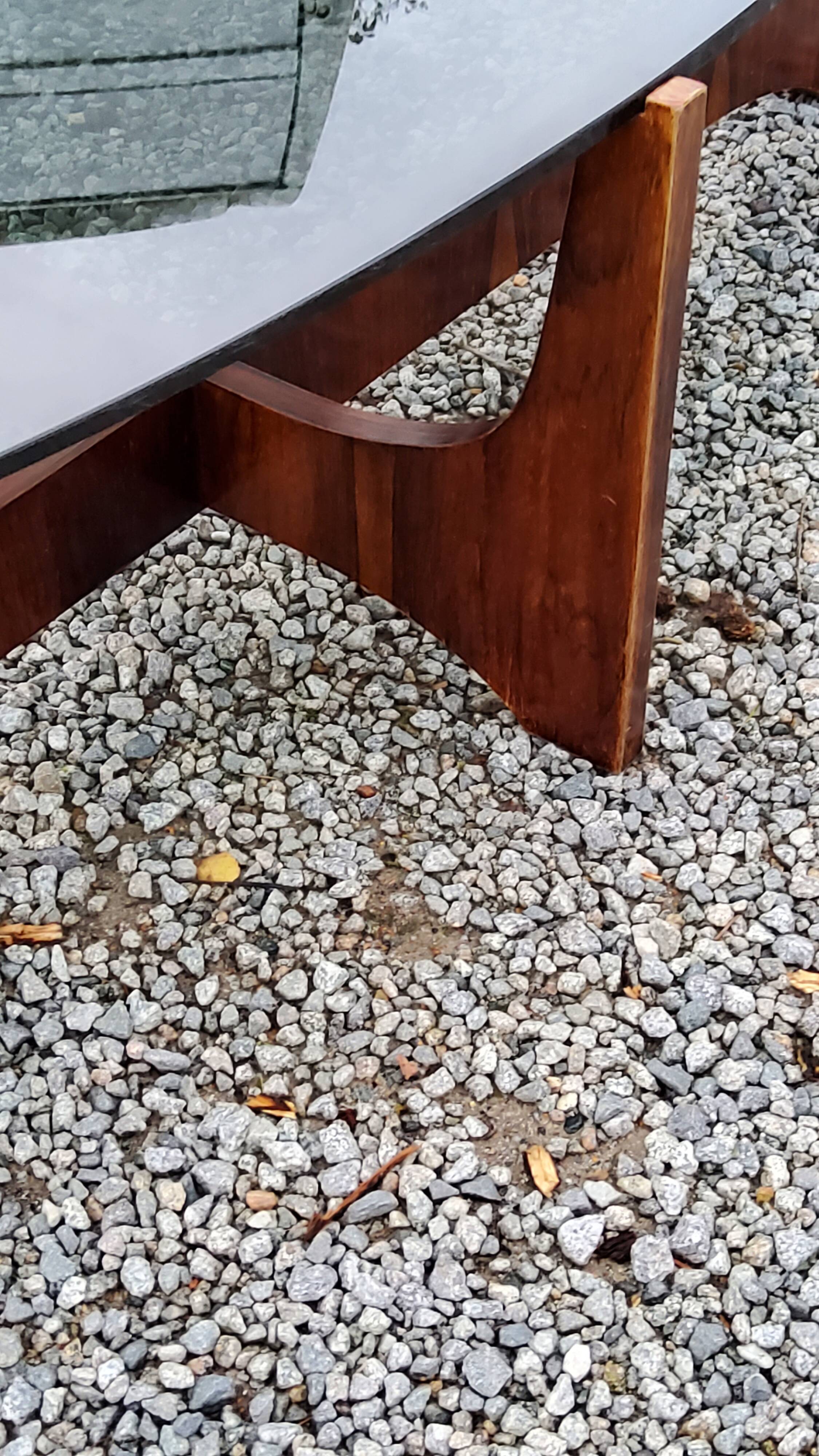 Designer coffee table by Hugues Poignant in rosewood and smoked glass from the 70s