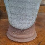 Enameled stoneware pitcher signed