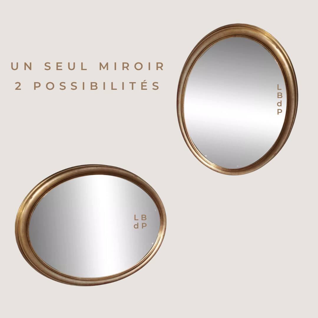 Grand et élégant miroir doré ovale avec sa glace biseauté