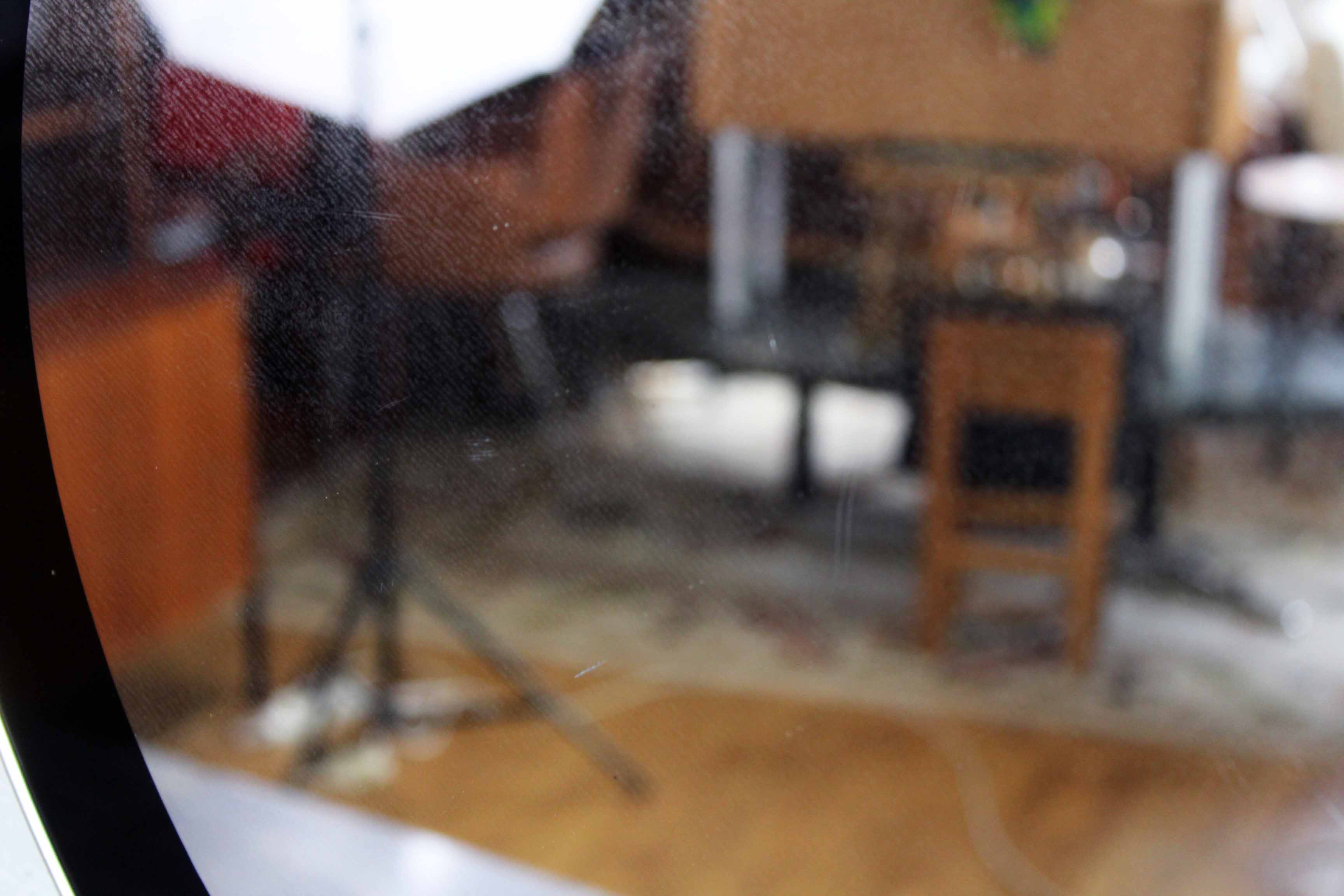 Black and gold 60s round mirror