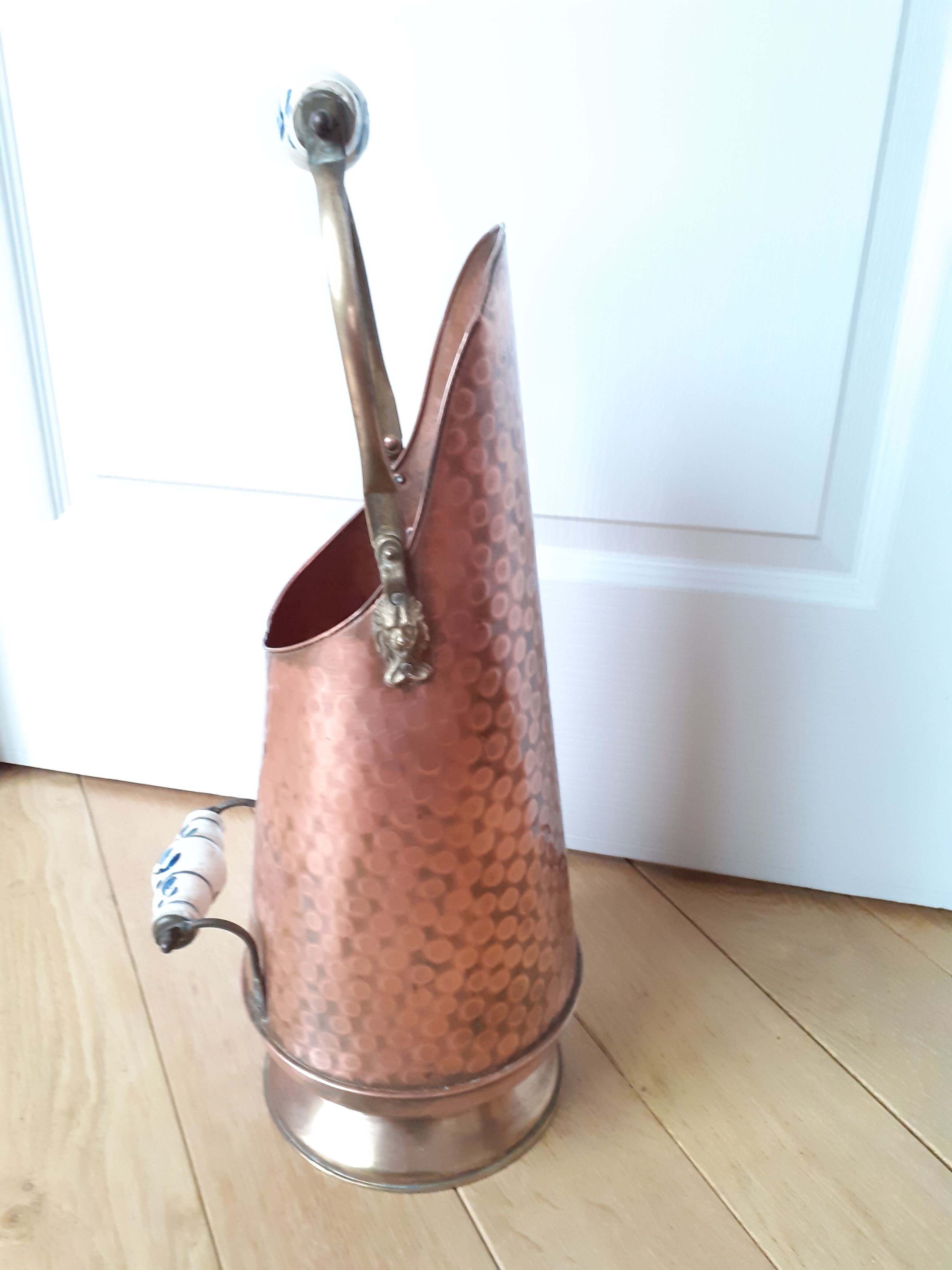 Old coal bucket made of copper and brass