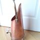 Old coal bucket made of copper and brass