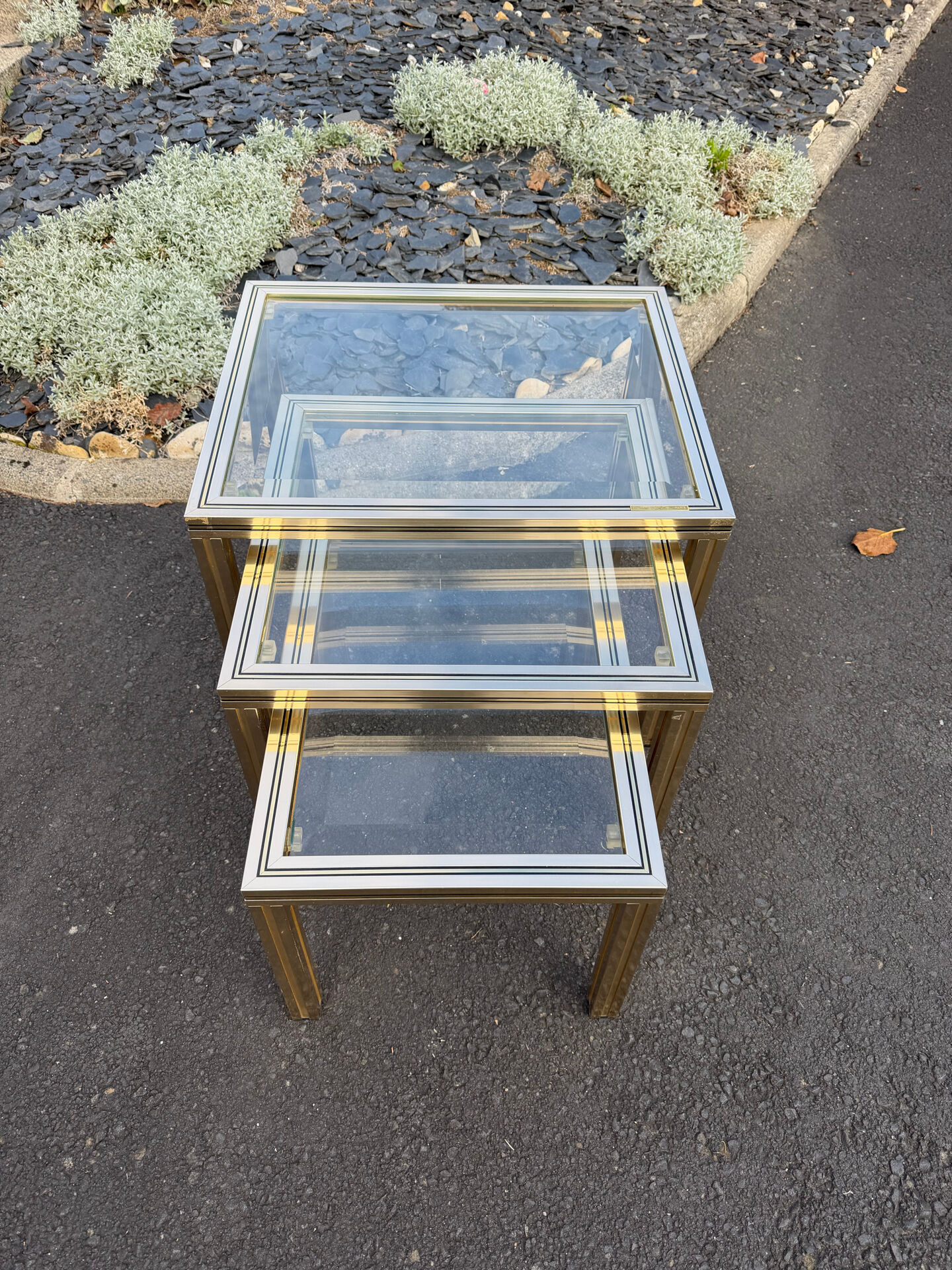Nested tables by Pierre Vandel Paris in gilded metal and glass, 1970s.