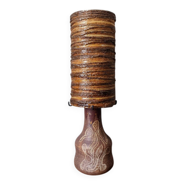Table lamp with terracotta base and resin shade.