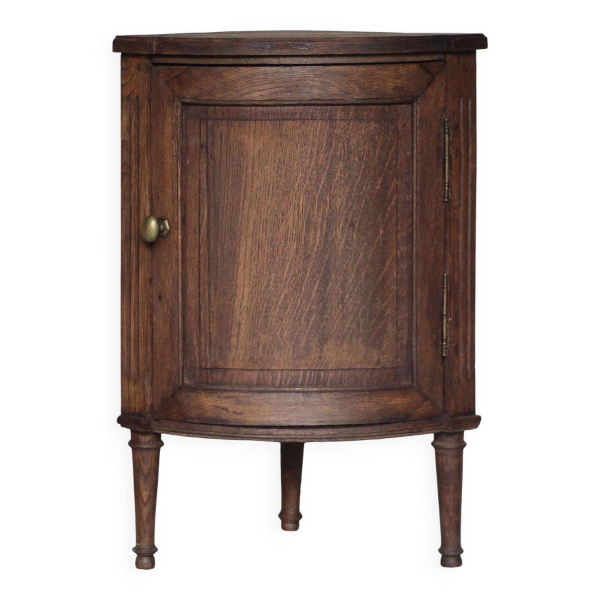 Antique wooden corner cabinet with a curved door.
