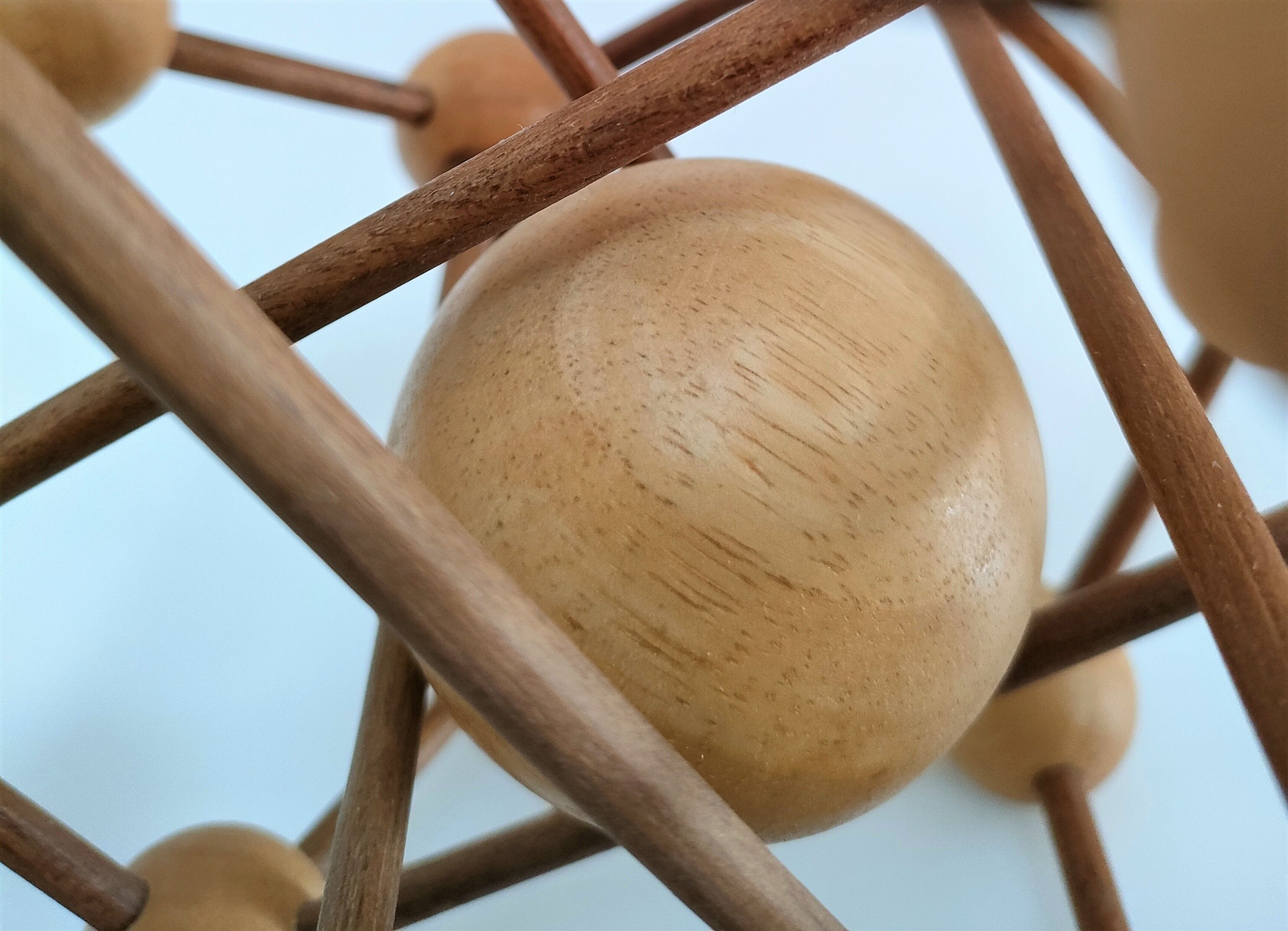 Sculptural modeling of a solid wood atom contemporary design