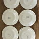 Lot de 12 assiettes motif fleurs de champagne.