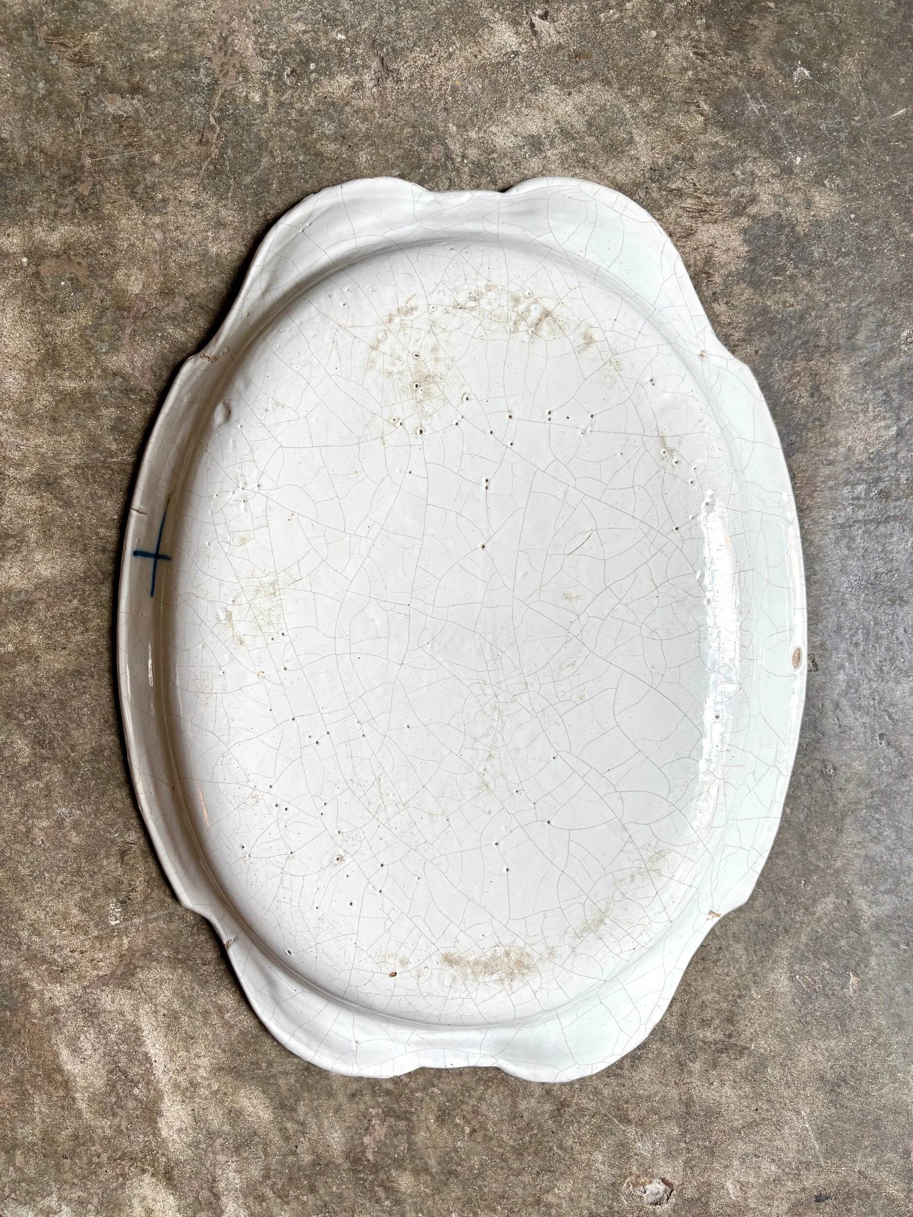 Moustiers hollow oval dish in glazed earthenware
